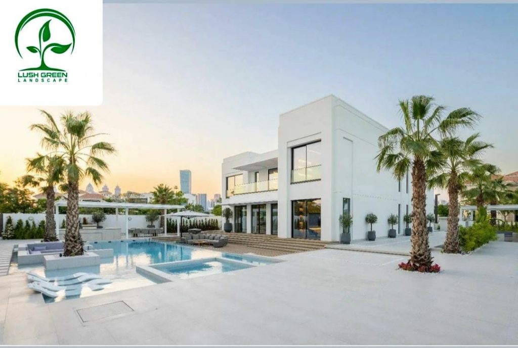 Pool terrace surrounded by palms and landscaped gardens